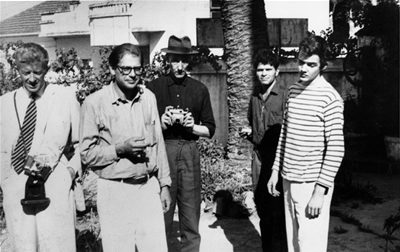 From left to right, Paul Bowles, Allen Ginsberg, William Burroughs, and others, early 1950s